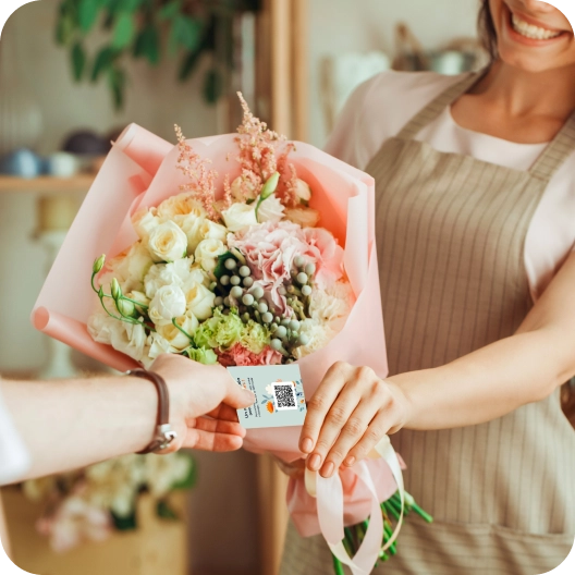 The customer buys a card with their flowers